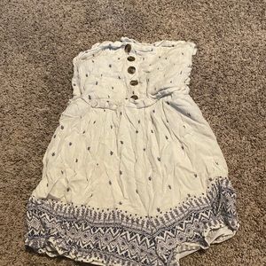 Size M white romper from American eagle has small blue floral details